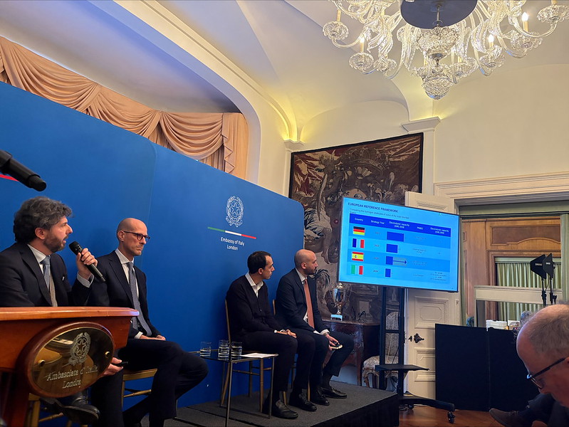 Panel of men from the Italian embassy presenting on infrastructure opportunities 